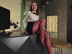 Watch sexy Nikky peel off her clothes but keep those tight burgundy pantyhose on. She spreads her legs and gives a steamy dildo footjob, rubbing and squeezing the toy with her nylon-clad feet.