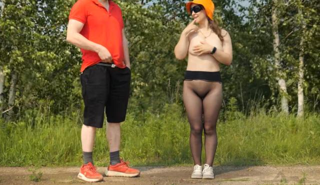 The girl, in sheer pantyhose, bends over, her ass up, her head down, as she masturbates the passerby, his moans filling the outdoor air